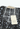 Aya Muse maxi dress in sequined black lightweight and semi-sheer - label close-up