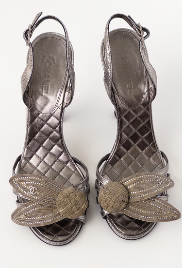 Chanel vintage silver heels with dark silver leather and floral appliqué detail, Fall 2007 - front view