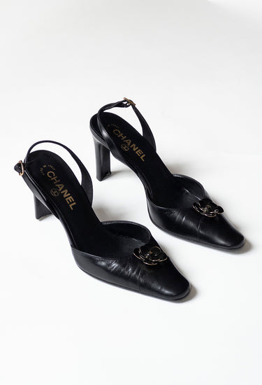 Chanel vintage Camellia heels in black leather - side profile