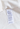 Alexander McQueen ruffle poplin blouse in white cotton, Resort '25 - label close-up