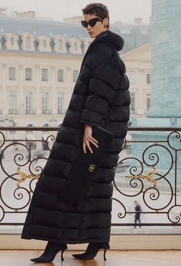 Balenciaga jumbo maxi clutch in black leather with gold BB monogram, 2024 - worn/try-on view