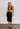 Chanel vintage knee skirt in black wool fabric with CC Chain Belt, 1998 - worn/try-on view