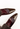 Louis Vuitton heels in chocolate hue patent leather with a ribbed wool leg warmer - material/texture close-up