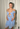 Di Petsa Theia wetlook dress in blue with gold jewellery chain with Lapis Lazuli crystals and a hand-carved sea shell pendant - worn/try-on view
