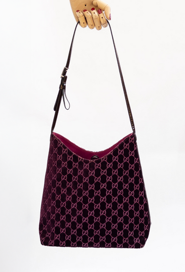 Gucci x Tom Ford bag in deep plum velvet with tonal monogram embroidery and leather strap and silver-tone hardware, 1997 - worn/try-on view