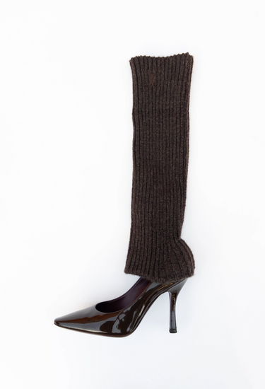 Louis Vuitton heels in chocolate hue patent leather with a ribbed wool leg warmer - side profile