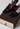 Louis Vuitton vintage plum heels in black patent leather with plum-toned velvet bow accent and gold-tone - angled view