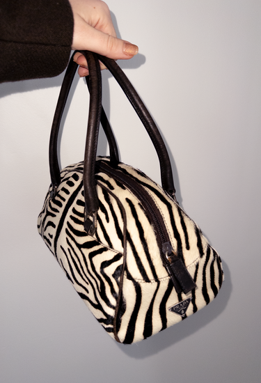 Prada Vintage top handle bag in zebra pony hair in leather handle - worn/try-on view