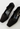 Prada Mary Jane heels in black rubber and nylon blend, 1999 - angled view