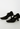 Prada Mary Jane heels in black rubber and nylon blend, 1999 - angled view