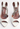 Amina Muaddi heels in white patent leather with crystal and "AWGE” logo charm - front view