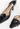 Chanel vintage Camellia heels inblack leather with camellia flower and a golden CC-embossed button - material/texture close-up