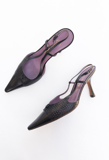 Chanel perforated heels in black supple leather with subtle tonal interlocking CC logo - side view