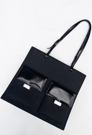 Gucci x Tom Ford GG monogram tote bag in black with  with patent leather front pockets and silver-tone logo clasps - angled view