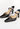 Louis Vuitton heels in black patent leather with miniature gold-tone LV cube charms - side profile
