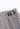 Miu Miu pleated skirt in gingham pattern with  two gold-tone buckled leather tabs at the waist - hardware close-up