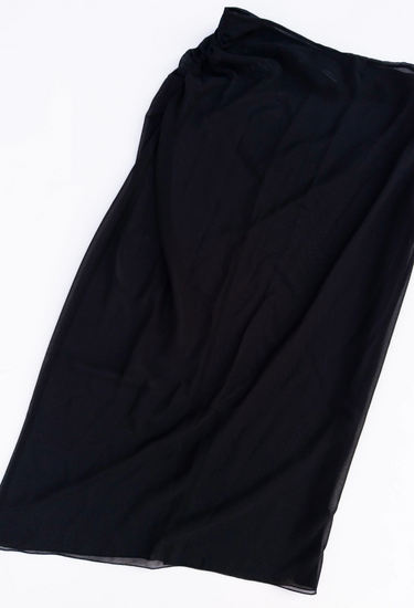 Prada midi skirt in black semi-sheer with removable inner layer, 2024 - angled view