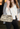 Prada shoulder bag in a fun black-and-ivory zebra motif - worn/try-on view