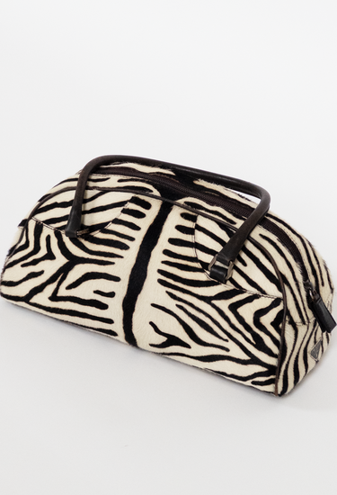Prada Vintage top handle bag in zebra pony hair in leather handle - angled view