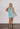 Versace x Dua Lipa mini halter dress in fresh pastel blue crepe - worn/try-on view